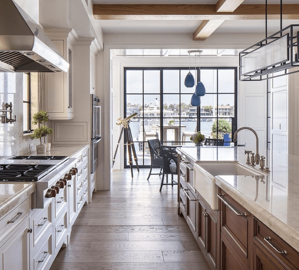 Modern custom kitchen cabinetry showing full-overlay flat panel doors and clean integrated hardware