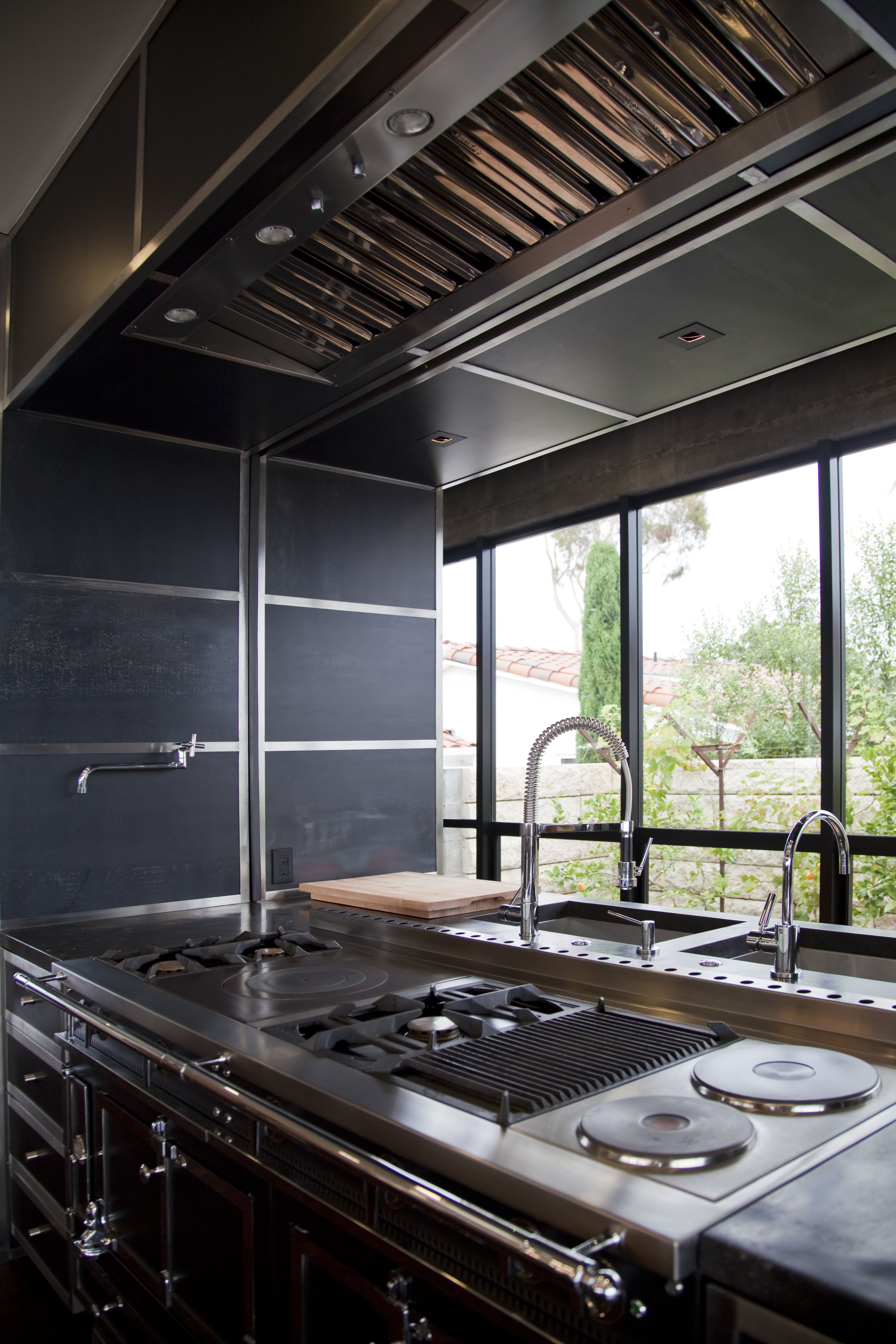 Contemporary flat-panel cabinetry with clean lines and concealed hardware, Orange County