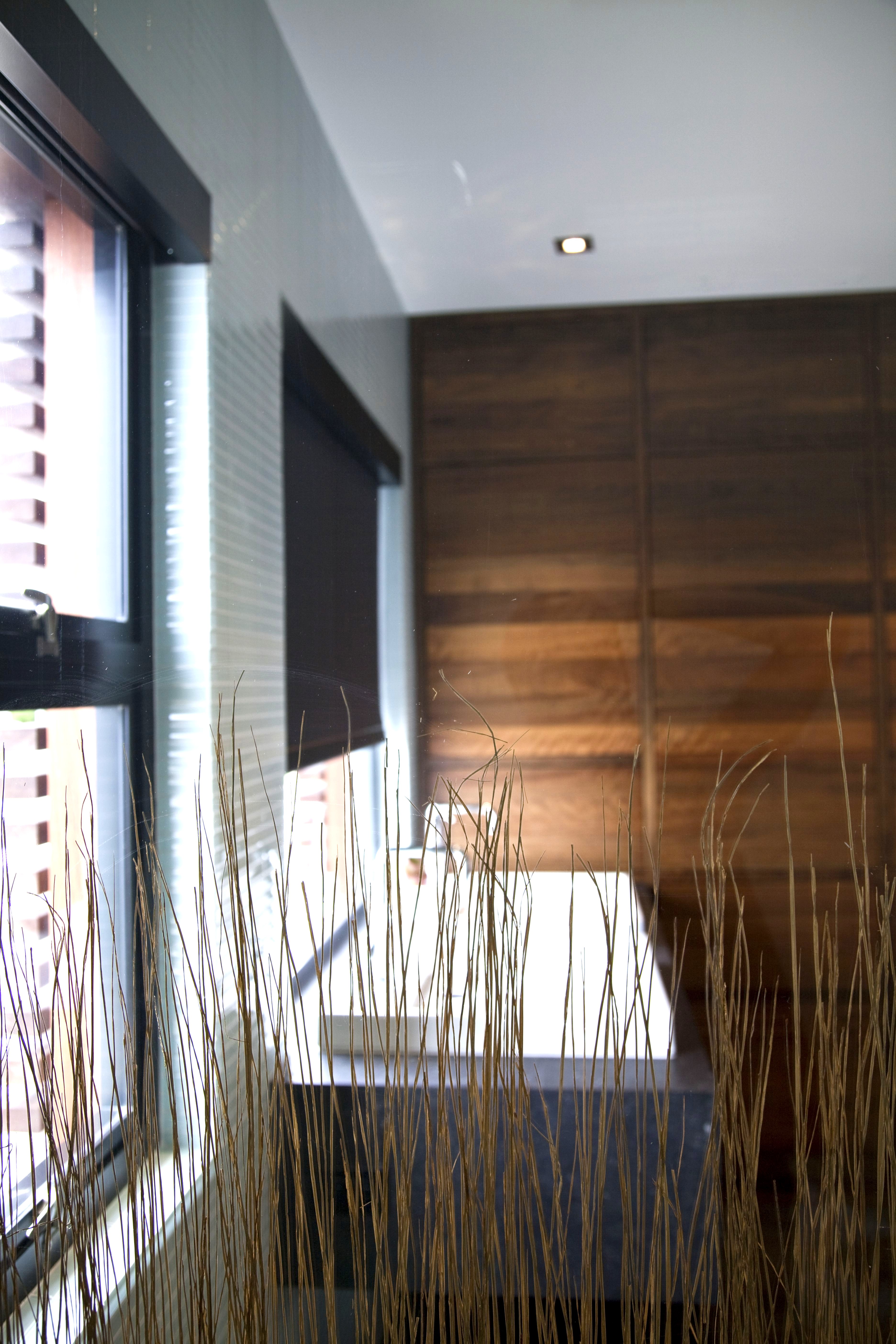 Dark wood custom bathroom cabinetry Newport Beach residence