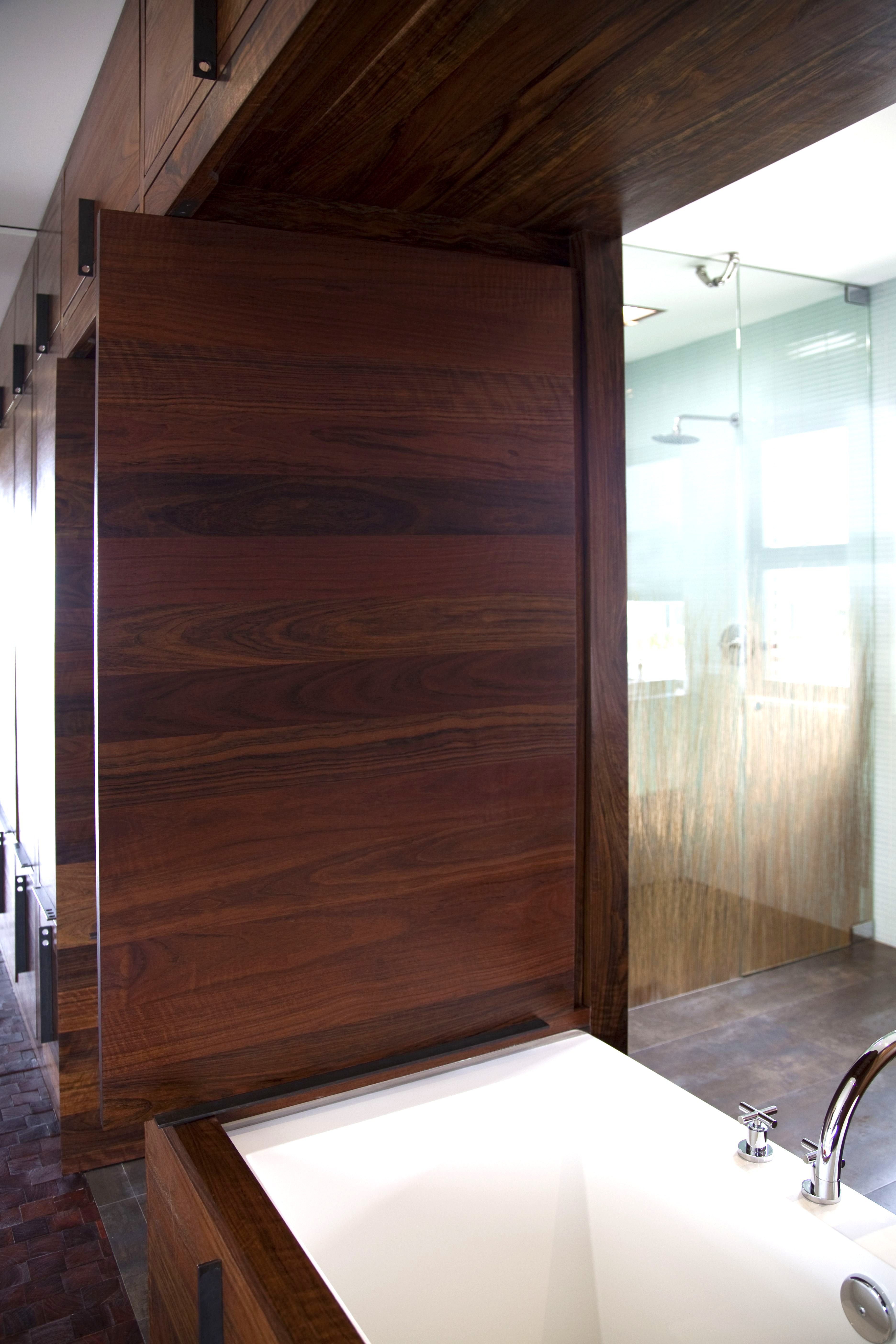 Custom walnut bathroom cabinet soaking tub Newport Beach
