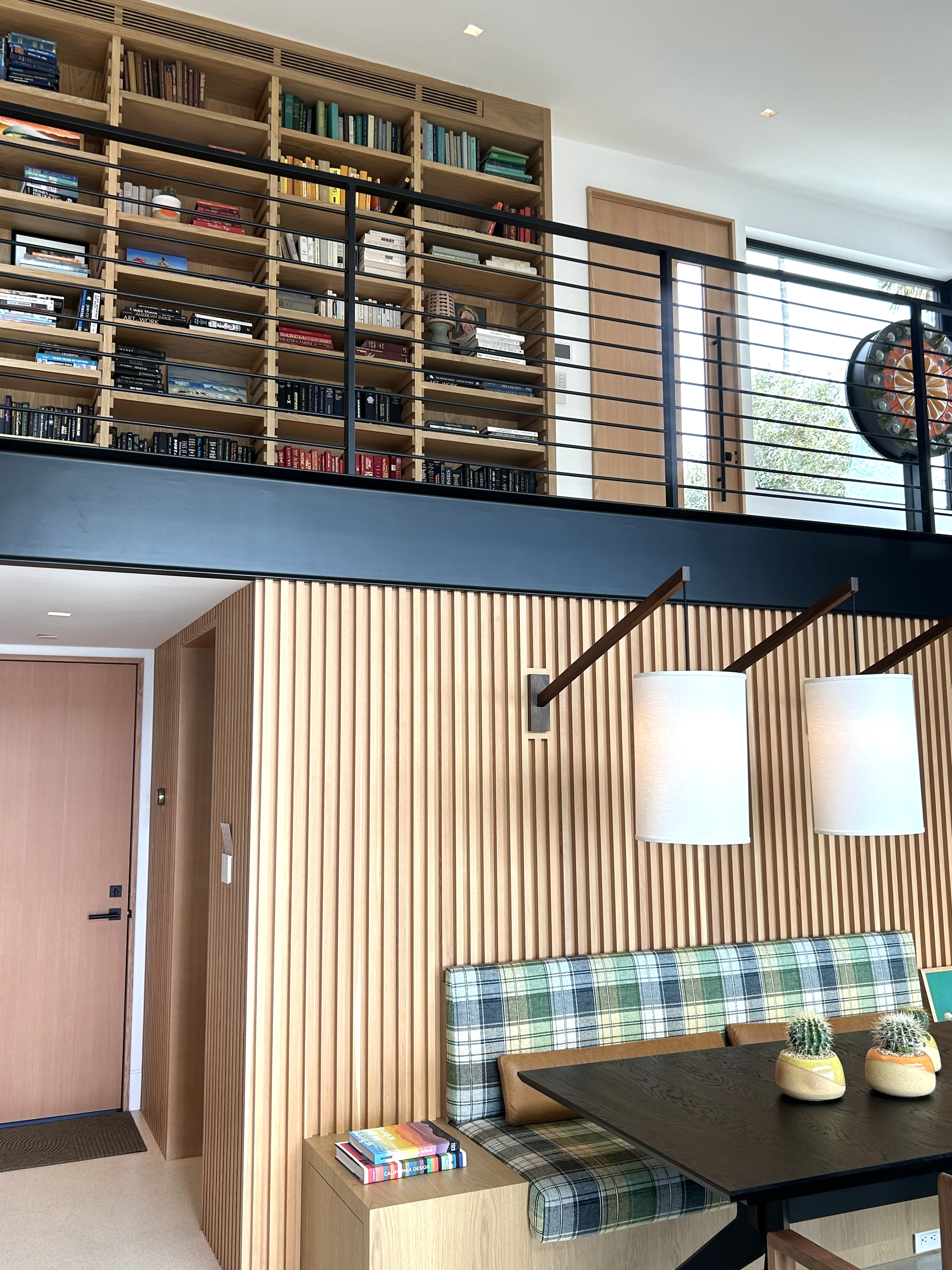 Modern white oak home bookcase staircase overview