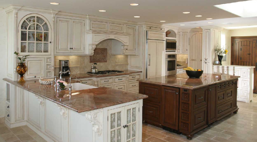 Ornamental custom cabinetry with carved surface detail, applied moulding, and decorative hardware