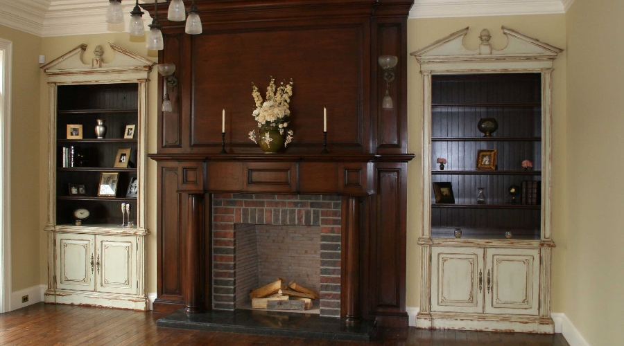 Rustic custom cabinetry detail showing natural wood grain, distressed finish, and antique hardware