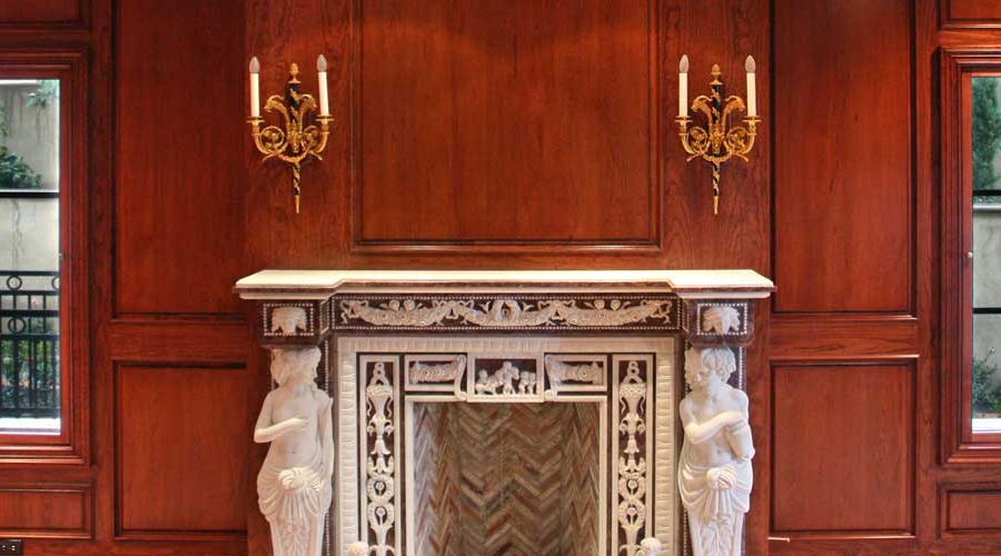 Shabby chic cabinet detail showing layered white paint, subtle distressing, and antique hardware