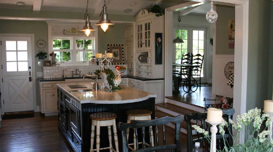 Antique-style custom kitchen cabinetry with classical profiles and aged finish, Newport Beach